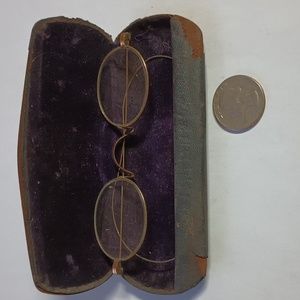 Vintage eyeglasses with purple velvet lined case
